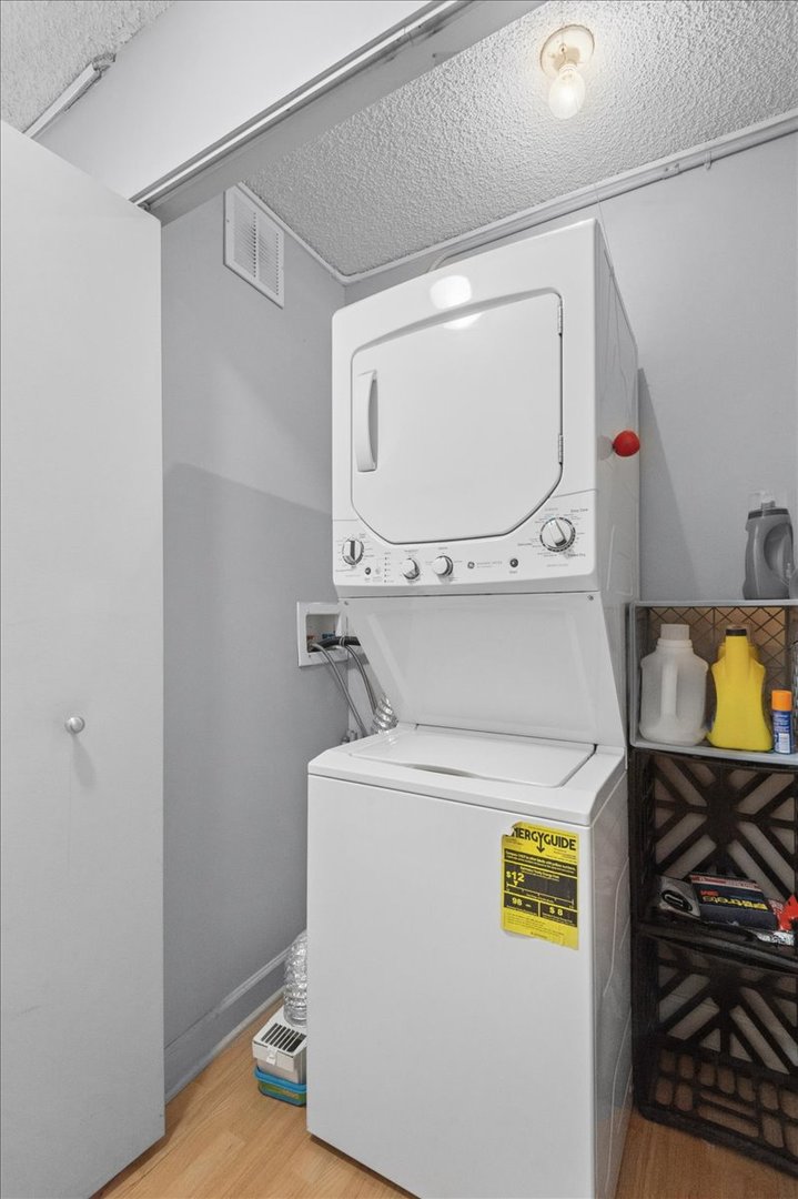 30 East Huron Street, Unit 2204 Chicago, IL 60611 - Photo 17 of 36 a utility room with dryer and washer