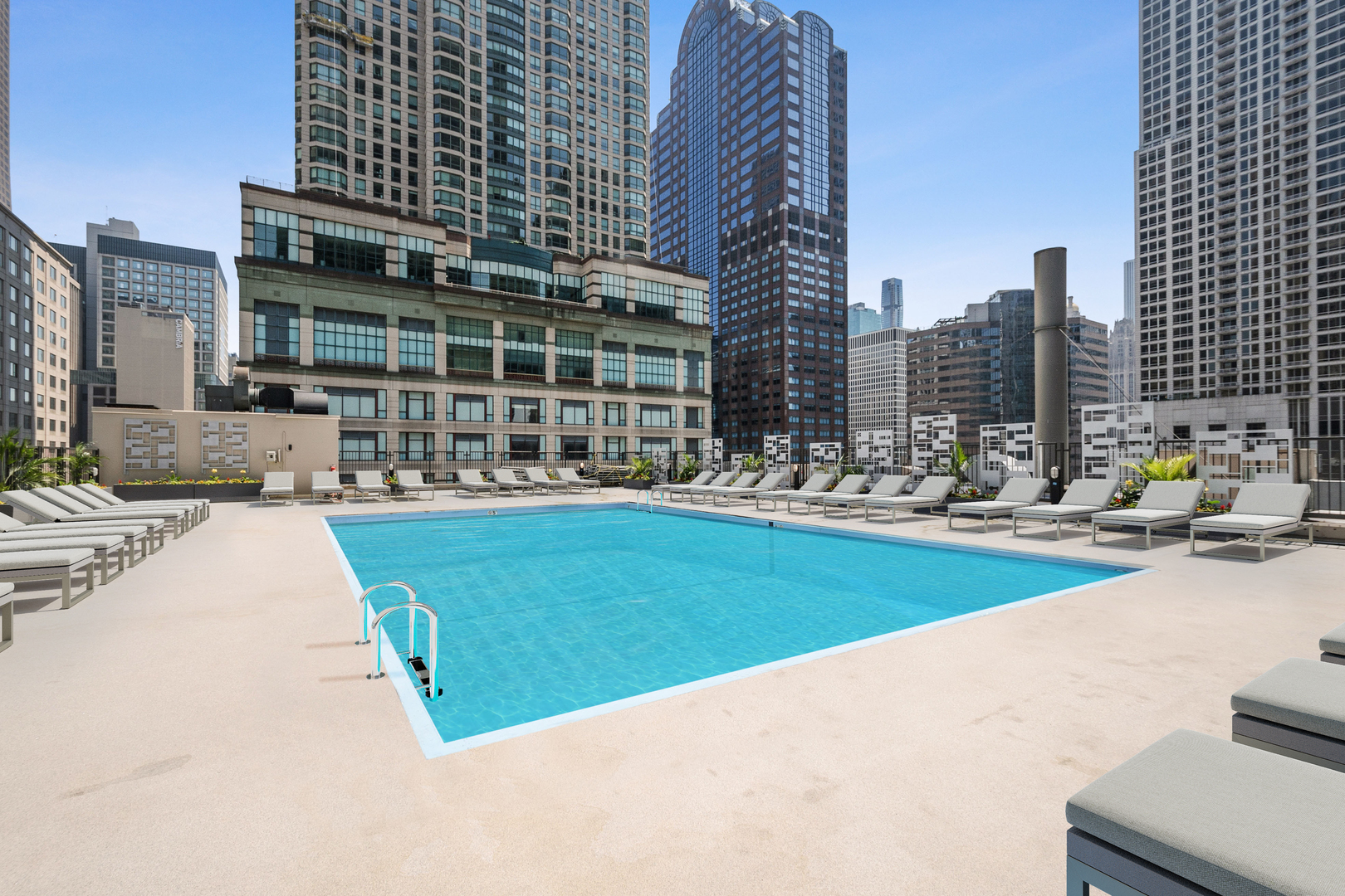 30 East Huron Street, Unit 2204 Chicago, IL 60611 - Photo 23 of 36 a view of swimming pool with outdoor seating and yard in the back