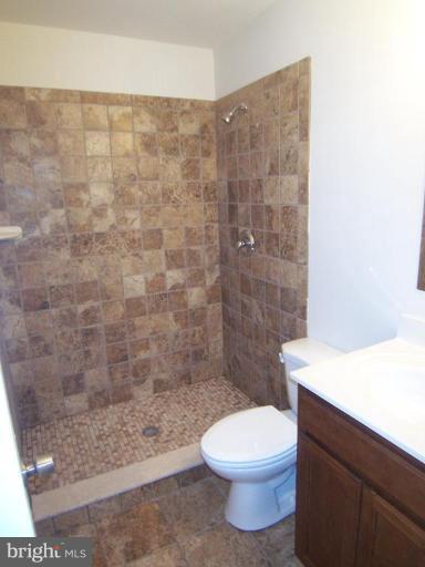 7909 Hart Road Fort Washington, MD 20744 - Photo 11 of 21 a bathroom with a toilet and a shower