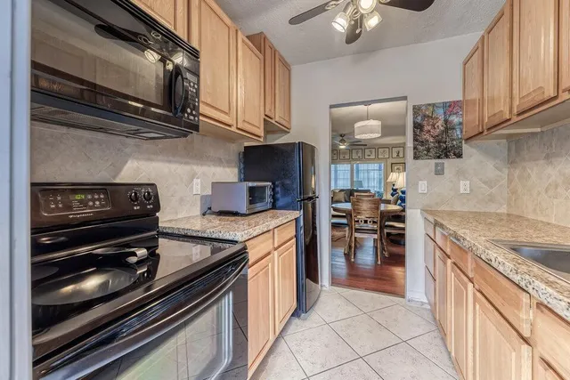 a kitchen with a stove and a microwave
