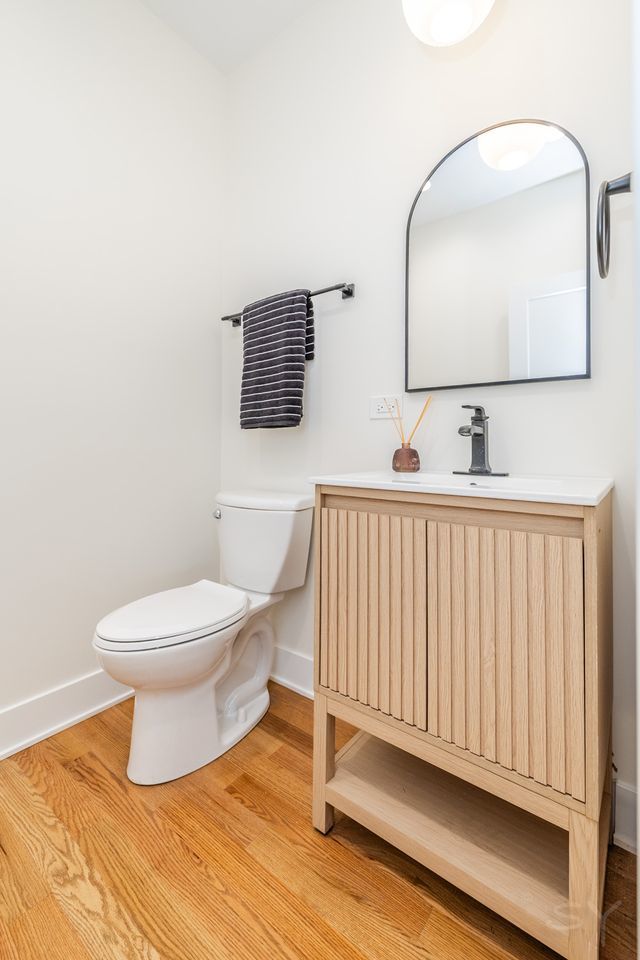 2247 South 6th Avenue North Riverside, IL 60546 - Photo 20 of 57 a bathroom with a toilet sink and mirror