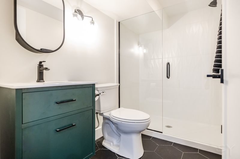 2247 South 6th Avenue North Riverside, IL 60546 - Photo 47 of 57 a bathroom with a sink a toilet and a mirror