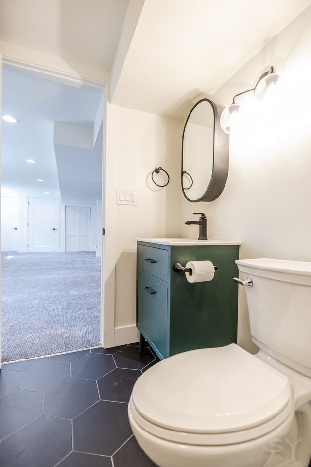 2247 South 6th Avenue North Riverside, IL 60546 - Photo 49 of 57 a bathroom with a toilet a sink and mirror