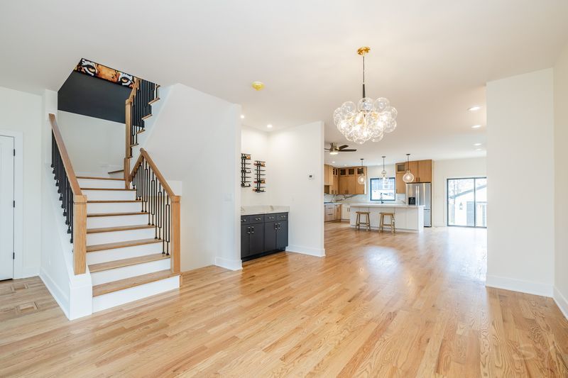 2247 South 6th Avenue North Riverside, IL 60546 - Photo 8 of 57 a view of a living room and kitchen with wooden floor