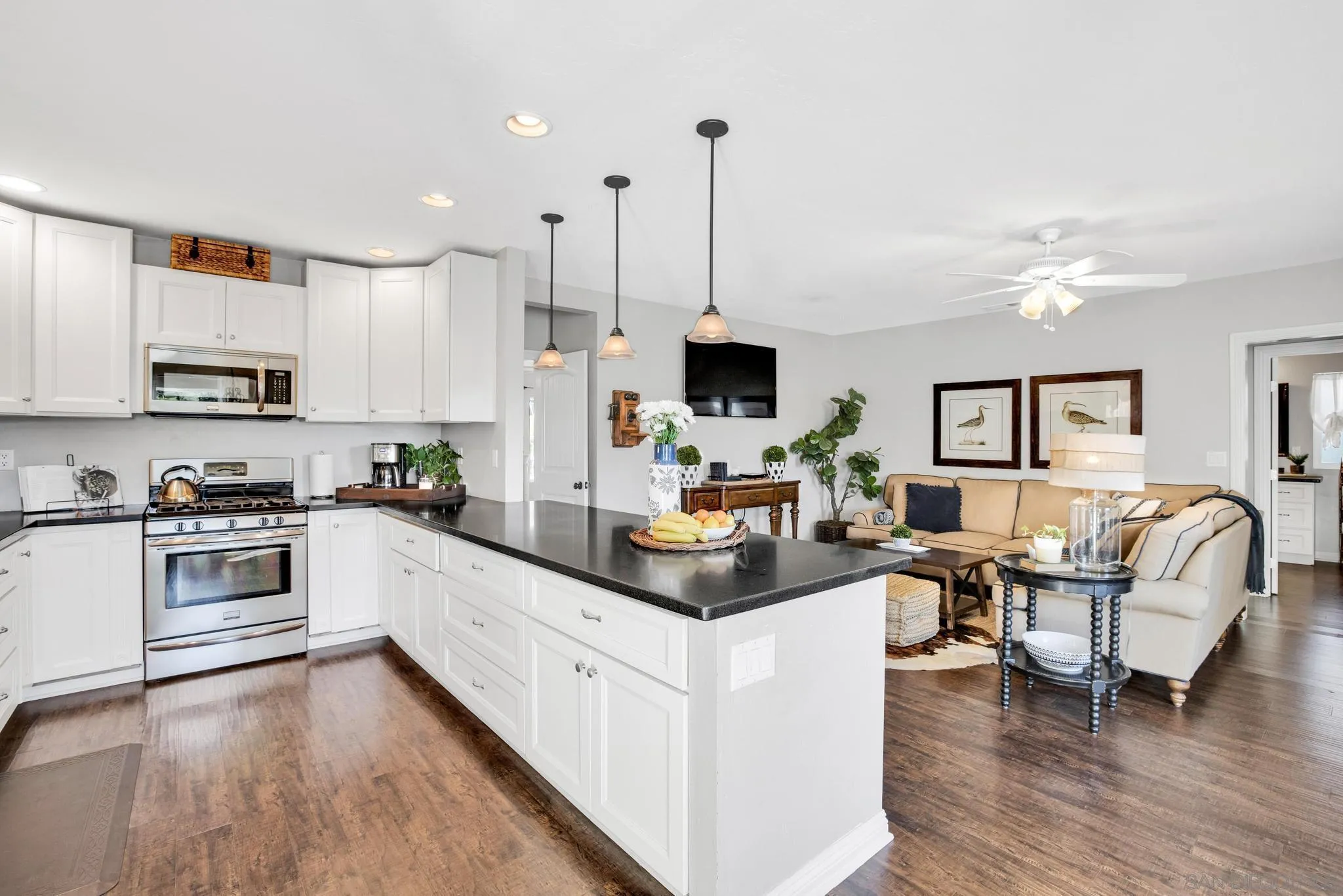 14409 Rios Canyon Road El Cajon, CA 92021 - Photo 16 of 47 a kitchen with white cabinets and appliances
