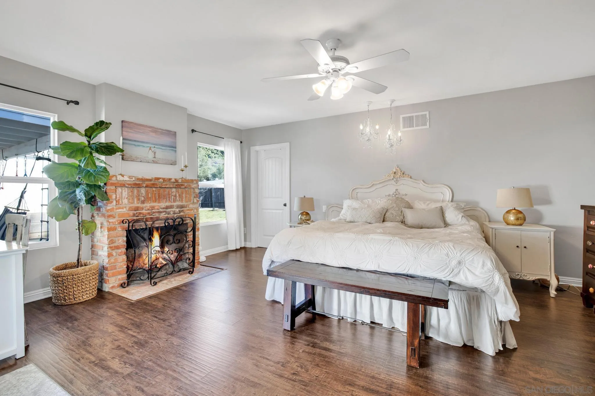 14409 Rios Canyon Road El Cajon, CA 92021 - Photo 26 of 47 a spacious bedroom with a bed and a fireplace