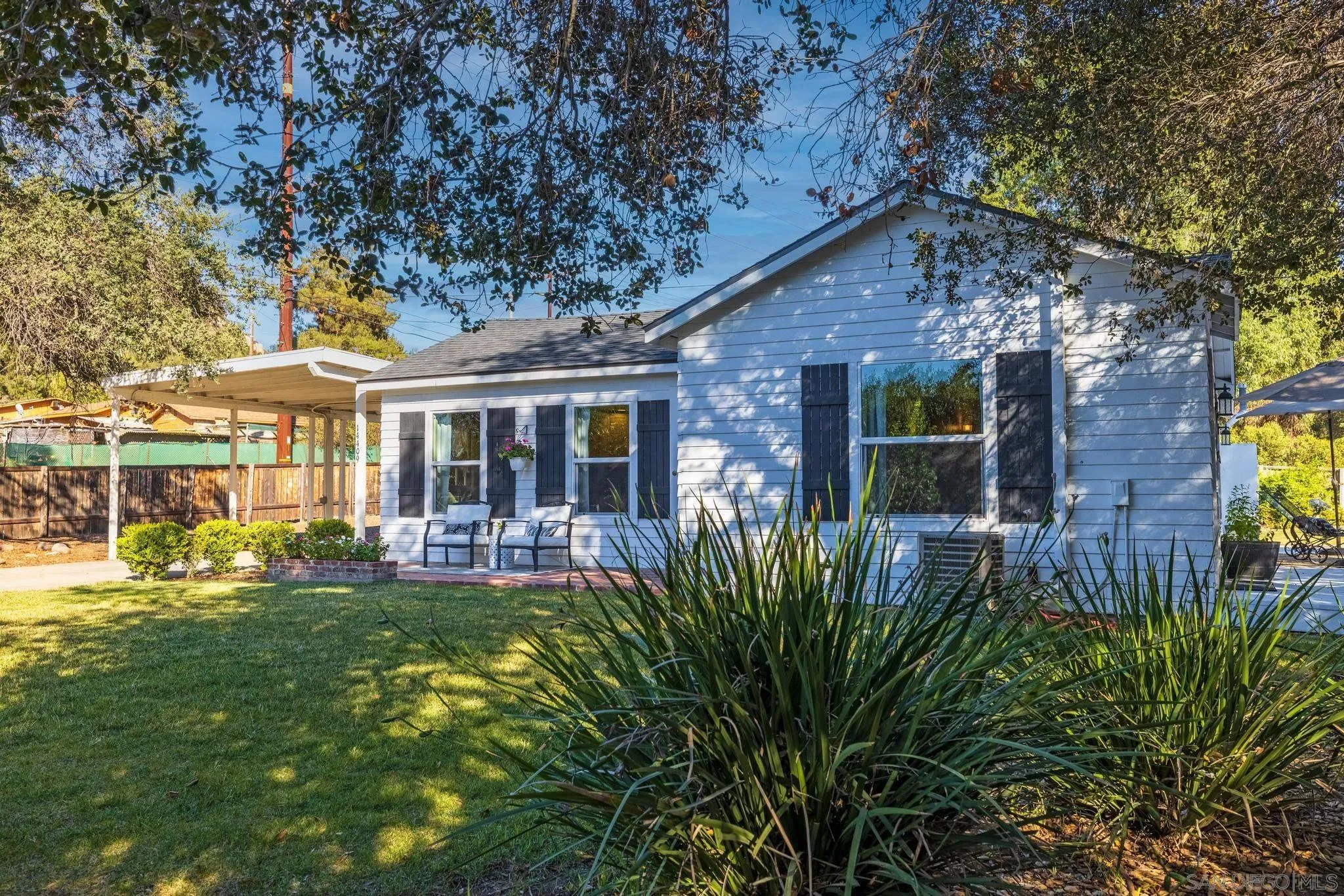 14409 Rios Canyon Road El Cajon, CA 92021 - Photo 3 of 47 front view of a house with a yard
