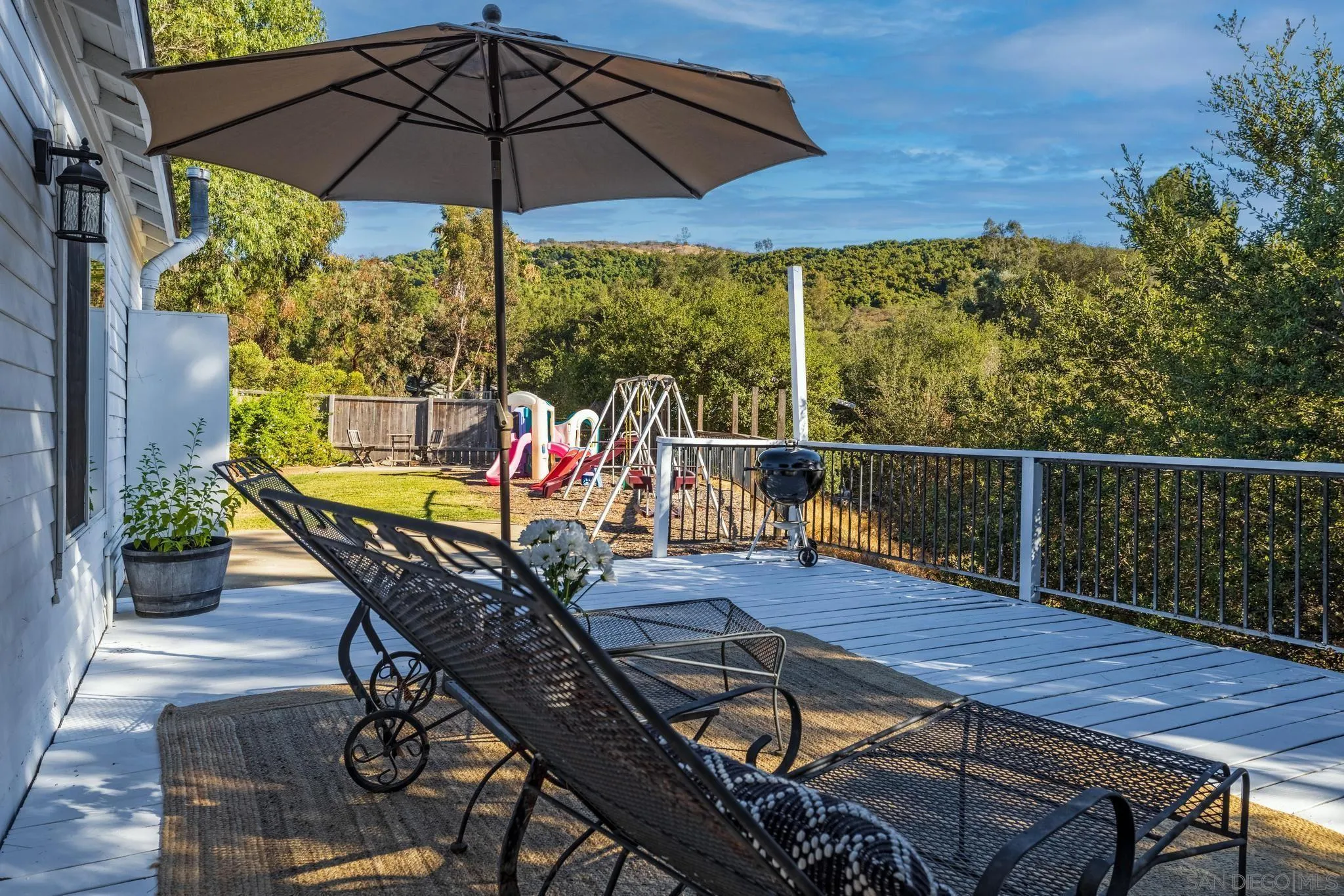 14409 Rios Canyon Road El Cajon, CA 92021 - Photo 36 of 47 a view of balcony with furniture and umbrella