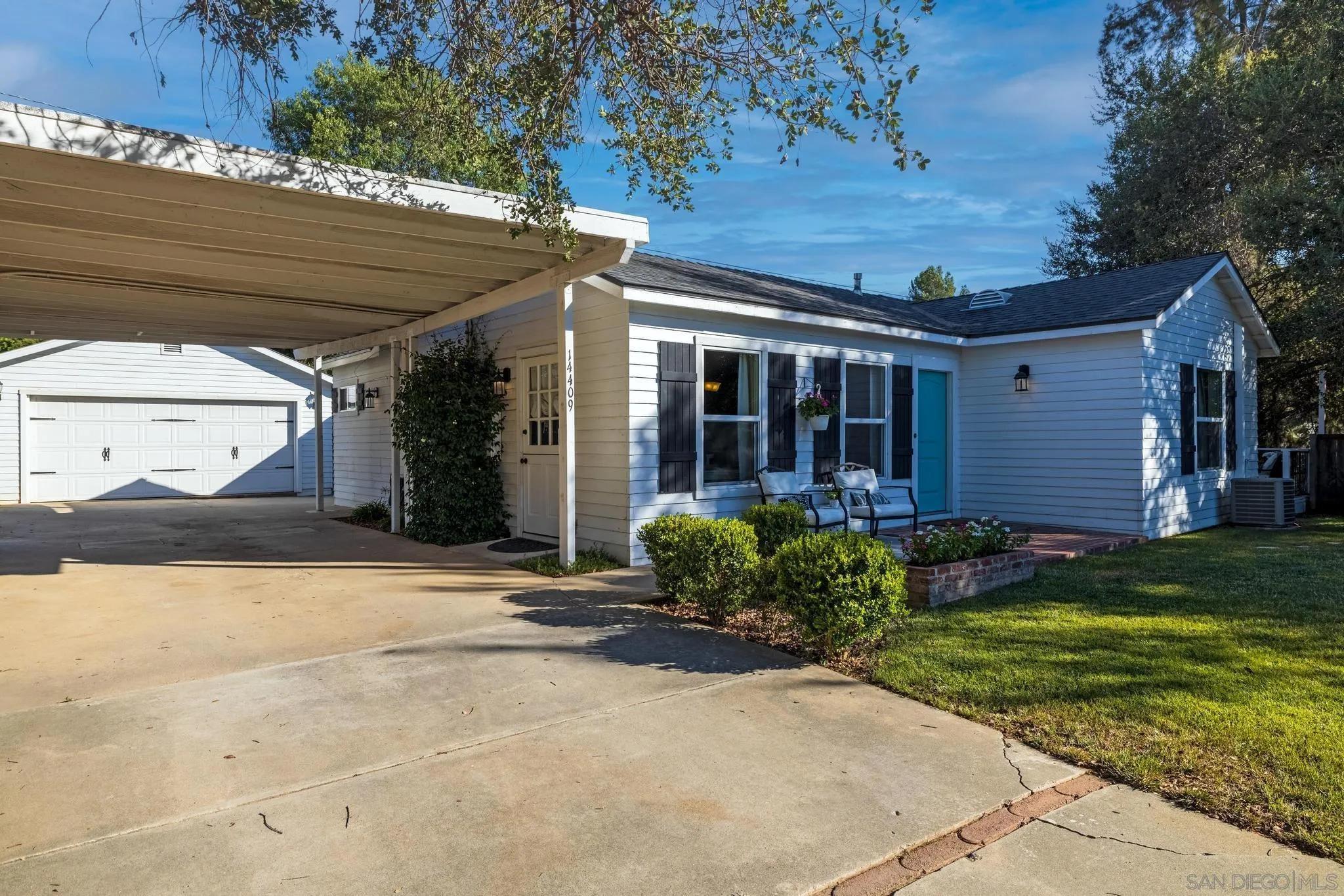 14409 Rios Canyon Road El Cajon, CA 92021 - Photo 4 of 47 a view of a house with backyard and garden