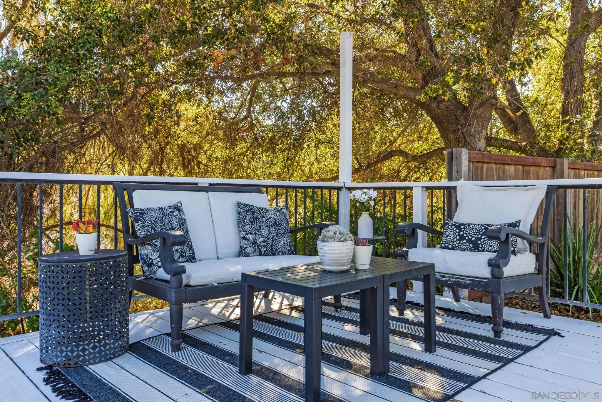 14409 Rios Canyon Road El Cajon, CA 92021 - Photo 7 of 47 a view of balcony with wooden floor and outdoor seating