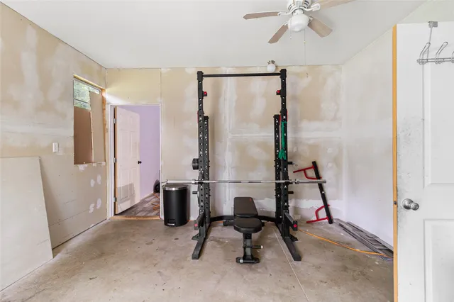 a view of entryway with workspace and windows