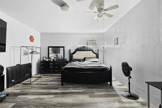 a bedroom with a bed and cabinets