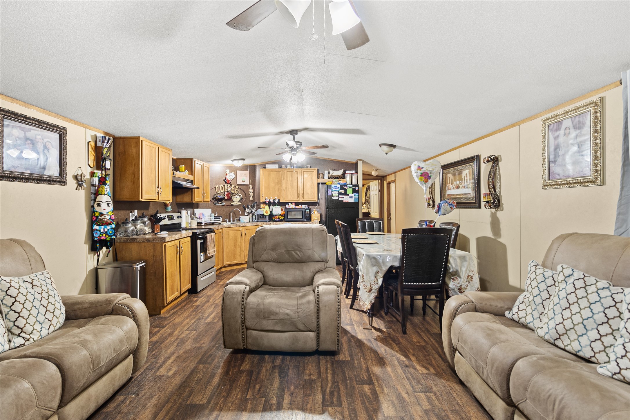 228 Geneva Road Huntsville, TX 77320 - Photo 4 of 26 a living room with furniture kitchen view and a wooden floor