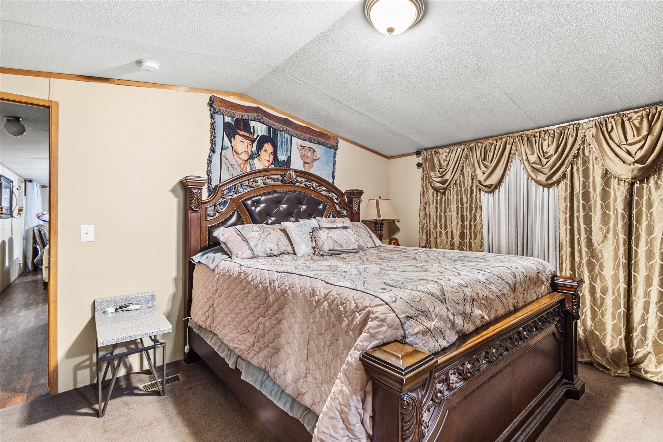 228 Geneva Road Huntsville, TX 77320 - Photo 8 of 26 a bedroom with a bed and a window