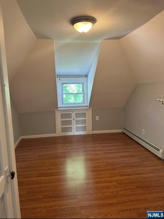 157 3rd Street, Unit 155 Newark, NJ 07107 - Photo 12 of 12 a view of an empty room with wooden floor and a window