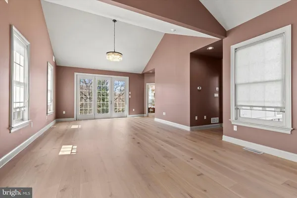 a kitchen with stainless steel appliances granite countertop a refrigerator and a stove
