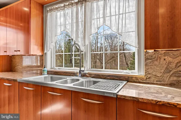 a bathroom with a sink double vanity and a large mirror