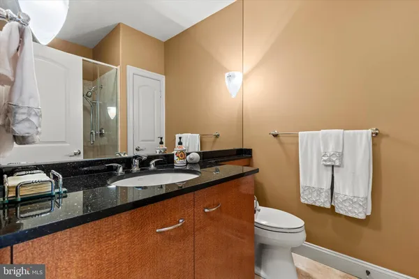 a spacious bathroom with a sink double vanity and a mirror
