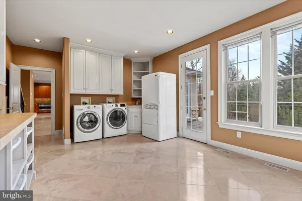 a kitchen with stainless steel appliances granite countertop a sink and cabinets