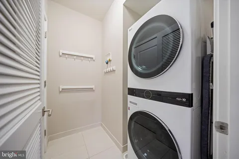 a close view of a utility room with dryer and washer