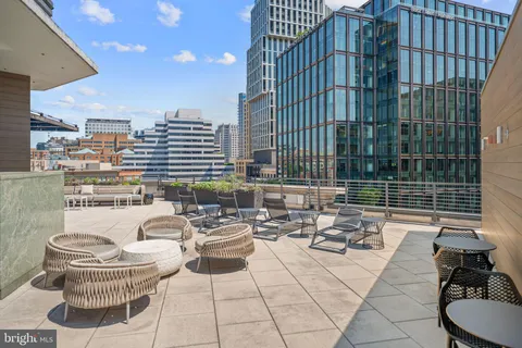 a view of a patio with couches and potted plants