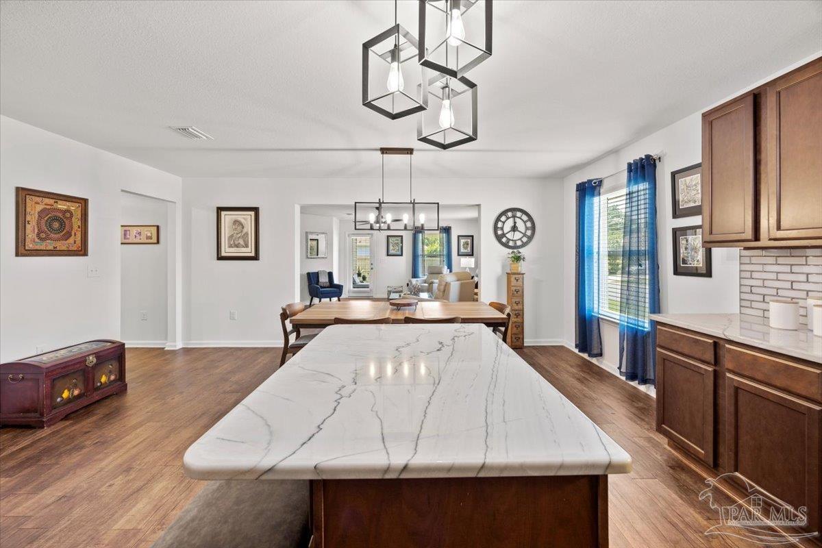 3473 Quail Drive Pace, FL 32571 - Photo 15 of 38 a large white kitchen with a large island