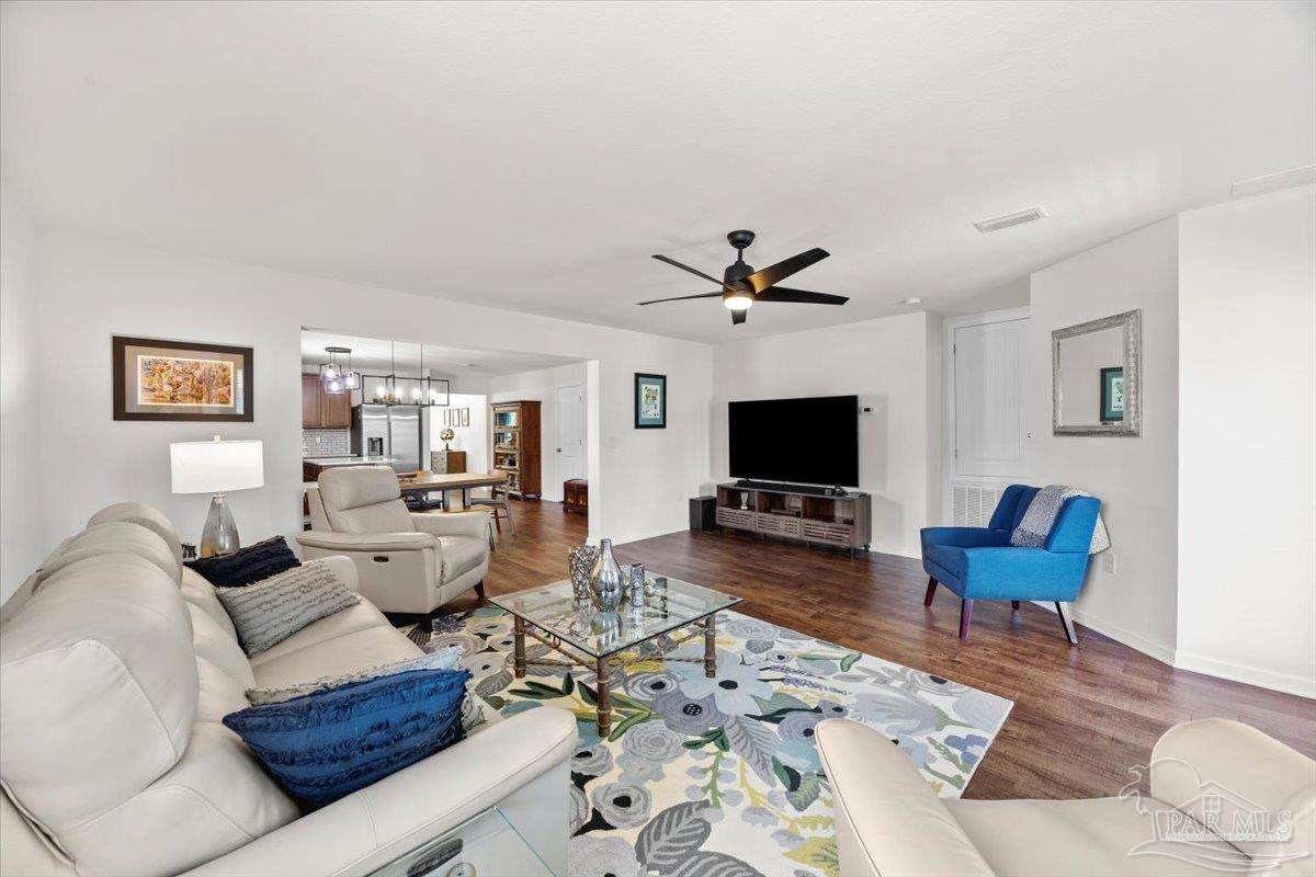 3473 Quail Drive Pace, FL 32571 - Photo 17 of 38 a living room with furniture or flat screen tv and a fireplace