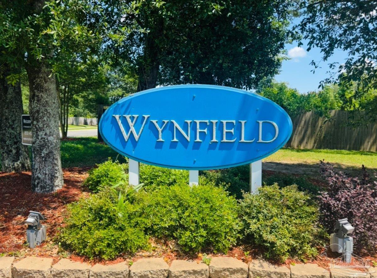 3473 Quail Drive Pace, FL 32571 - Photo 2 of 38 a view of a swimming pool with a yard