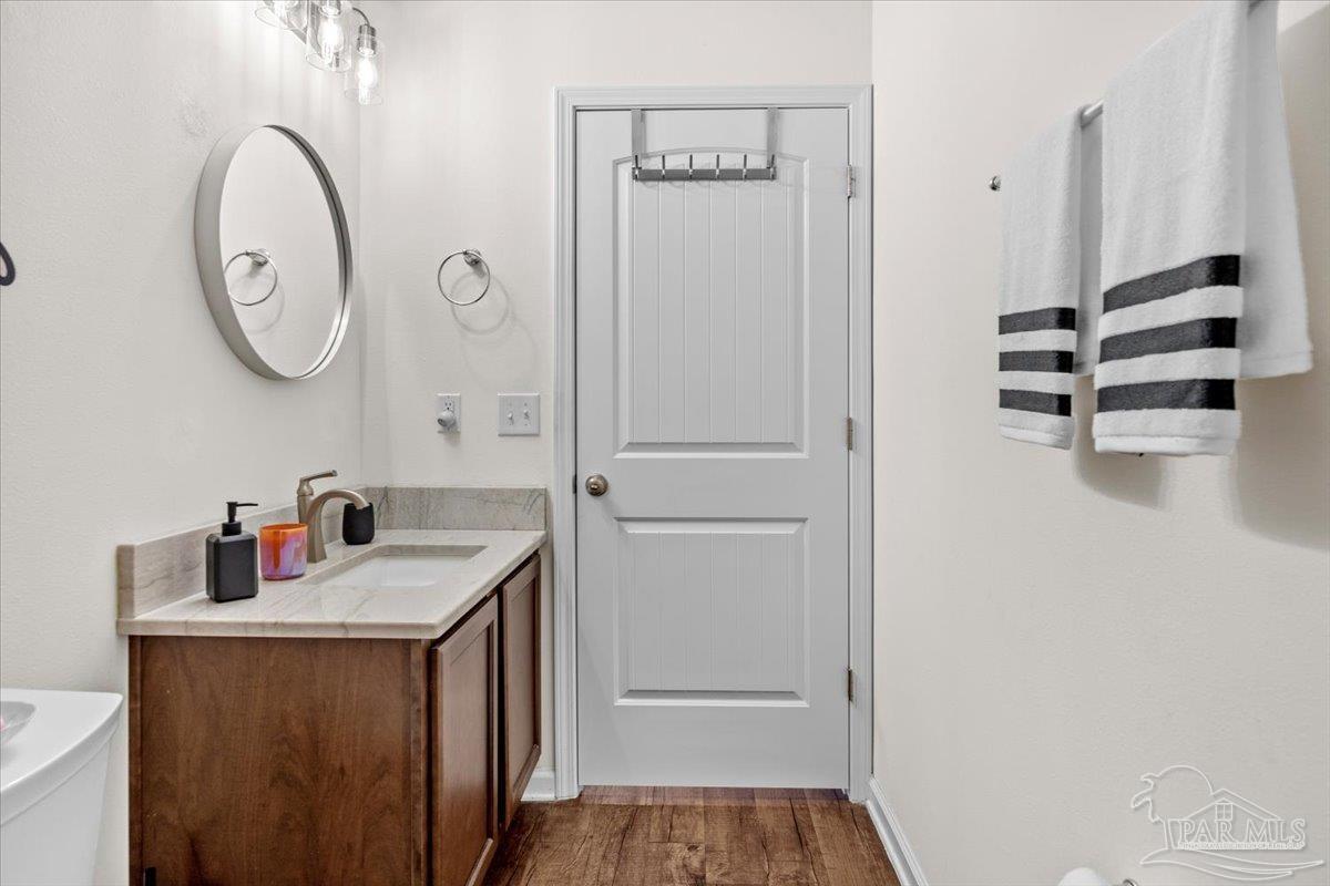 3473 Quail Drive Pace, FL 32571 - Photo 26 of 38 a bathroom with a sink and a mirror