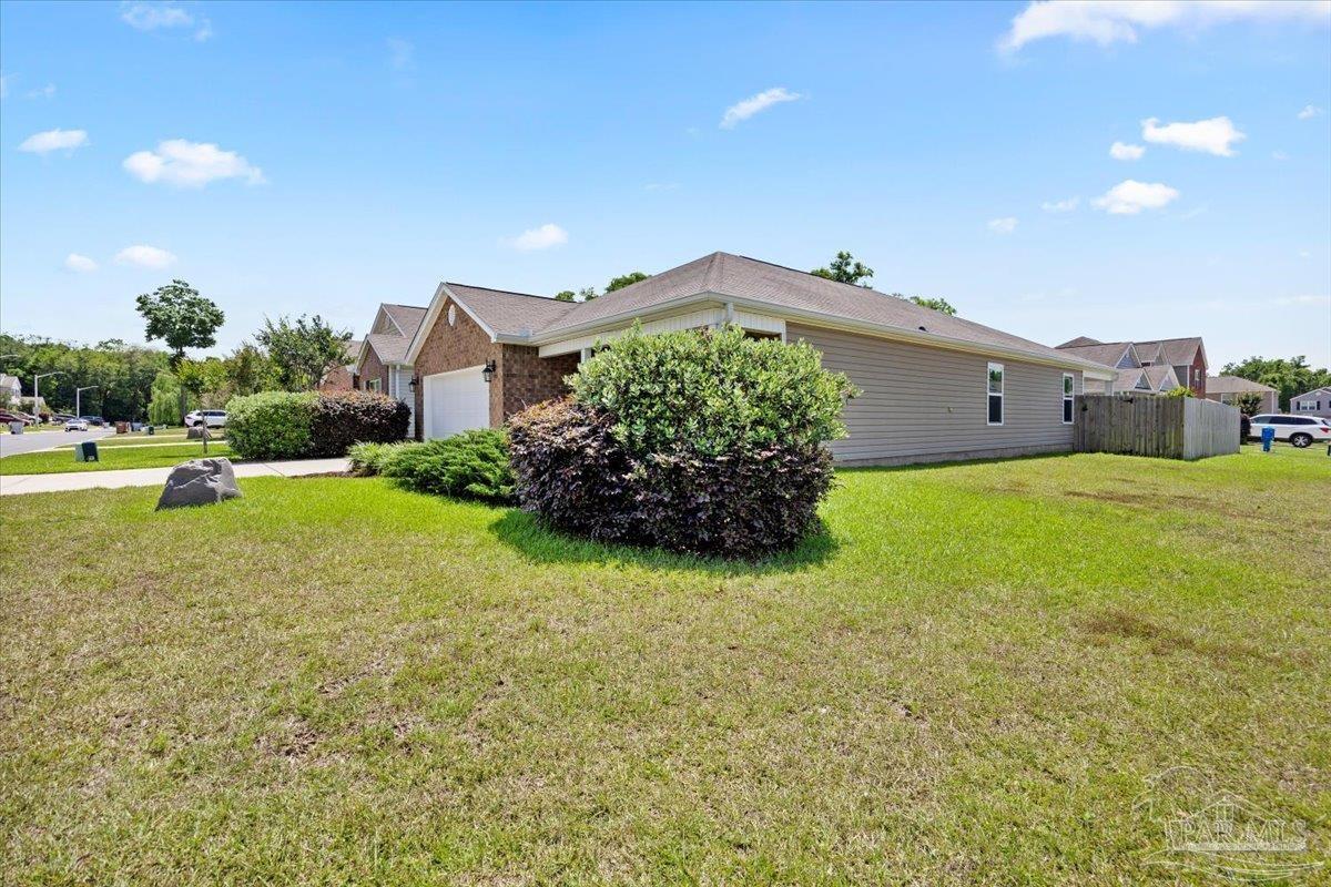 3473 Quail Drive Pace, FL 32571 - Photo 31 of 38 a house view with a garden space