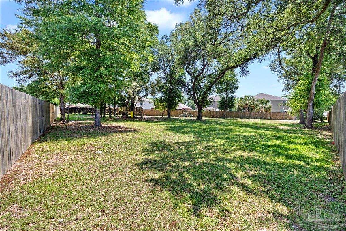 3473 Quail Drive Pace, FL 32571 - Photo 35 of 38 a view of a park with large trees