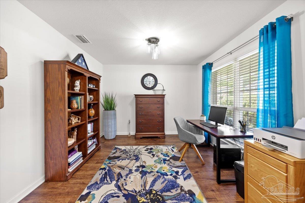 3473 Quail Drive Pace, FL 32571 - Photo 6 of 38 a workspace with furniture hardwood and a window