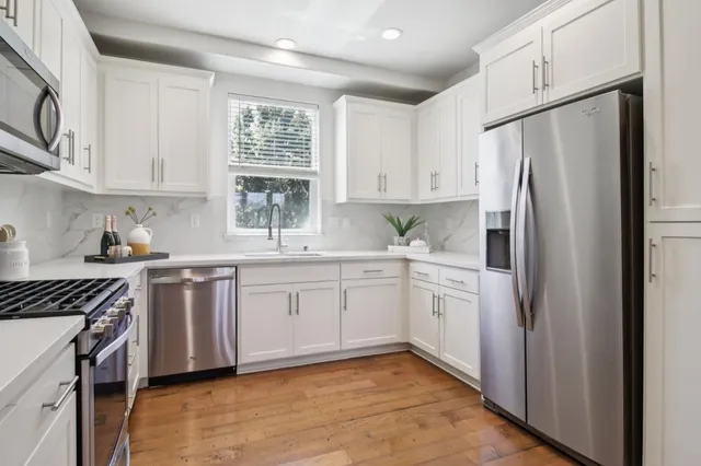 a bathroom with a sink toilet and mirror