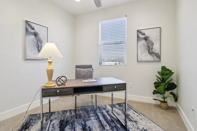 a bathroom with a sink a toilet a tub and shower