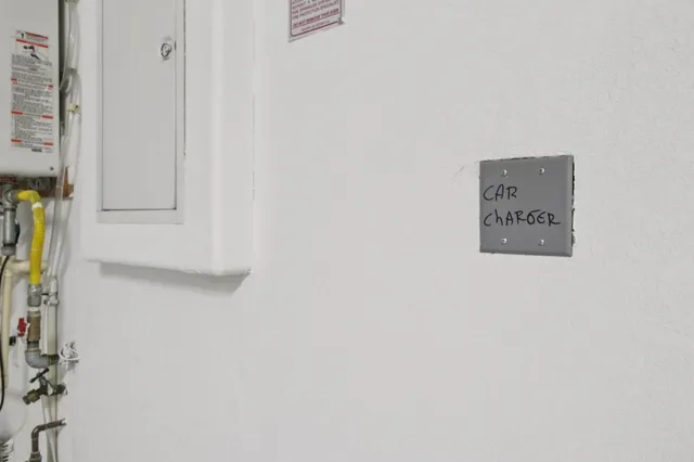 an aerial view of a house with a swimming pool a yard and lake view