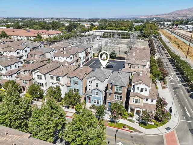 a view of swimming pool with building in the background