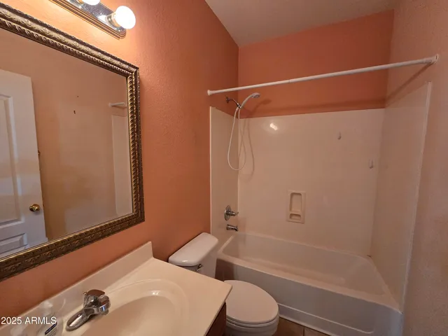 a bathroom with a shower and a toilet