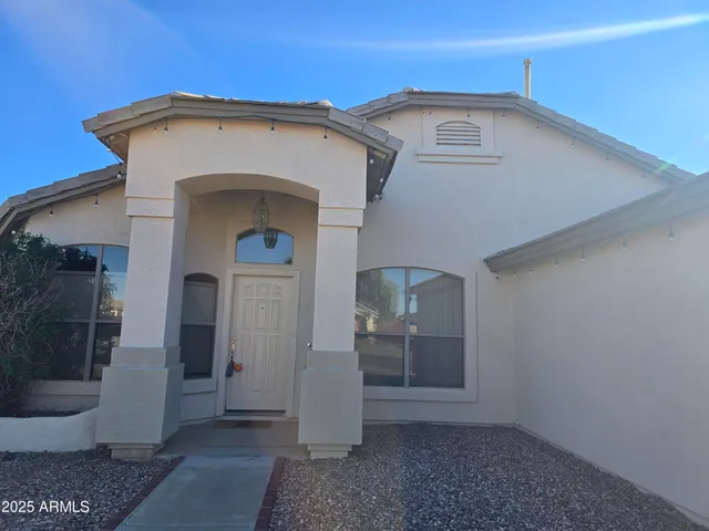 a view of a hallway with entryway and front door