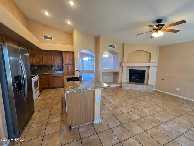 a kitchen with cabinets and stainless steel appliances