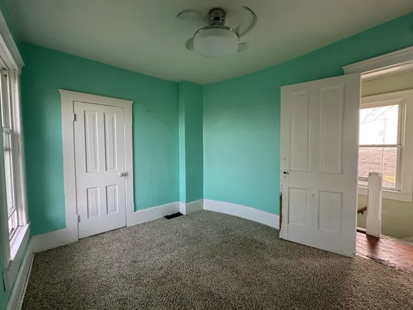 a view of an empty room and window