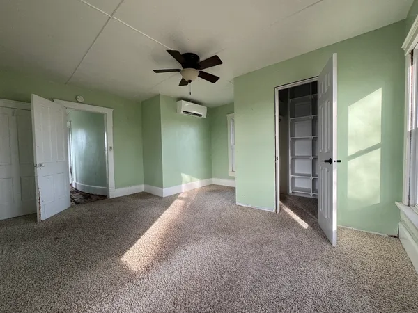 wooden floor and window in an empty room