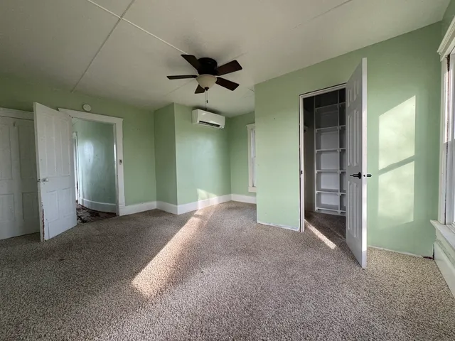 wooden floor and window in an empty room