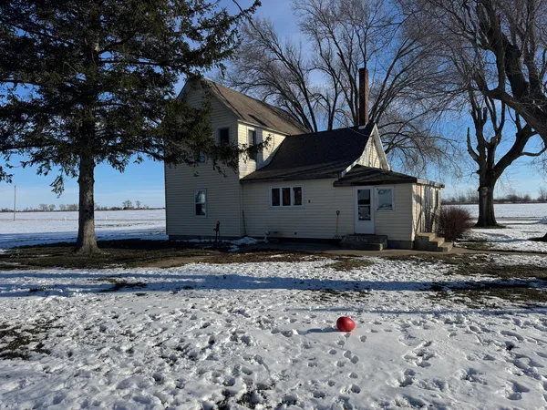 a view of a old house with a yard