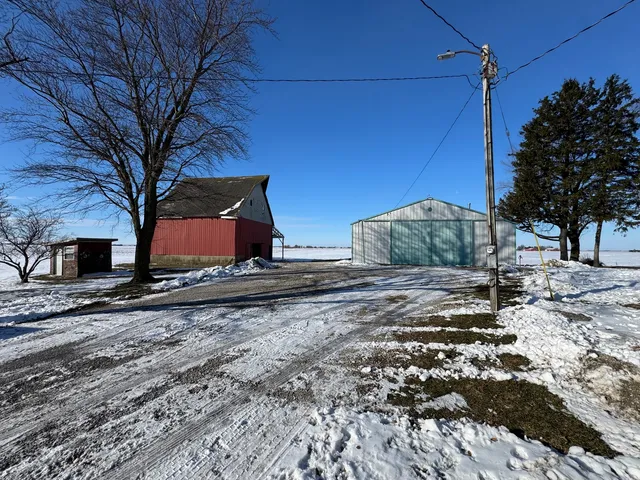 a view of a backyard with wooden fence