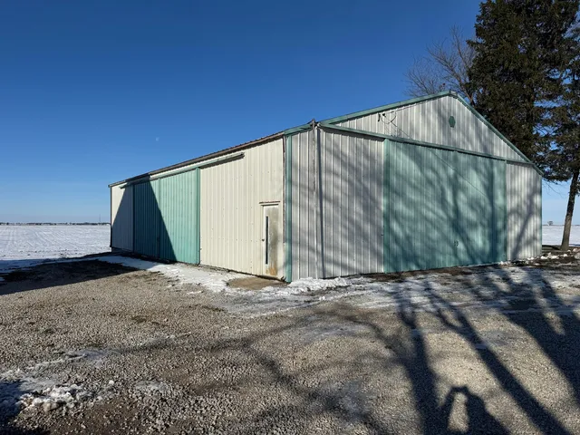 a backyard of a house with a yard and garage