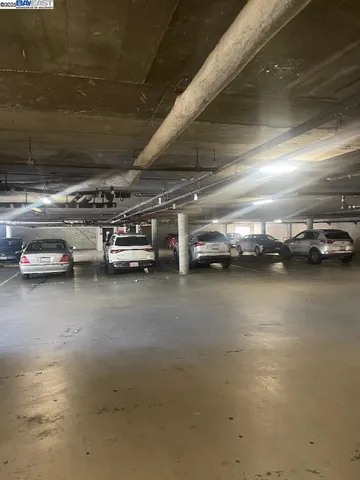 a view of a hallway with wooden shelves
