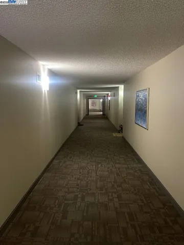 a kitchen with stainless steel appliances granite countertop a refrigerator and a stove