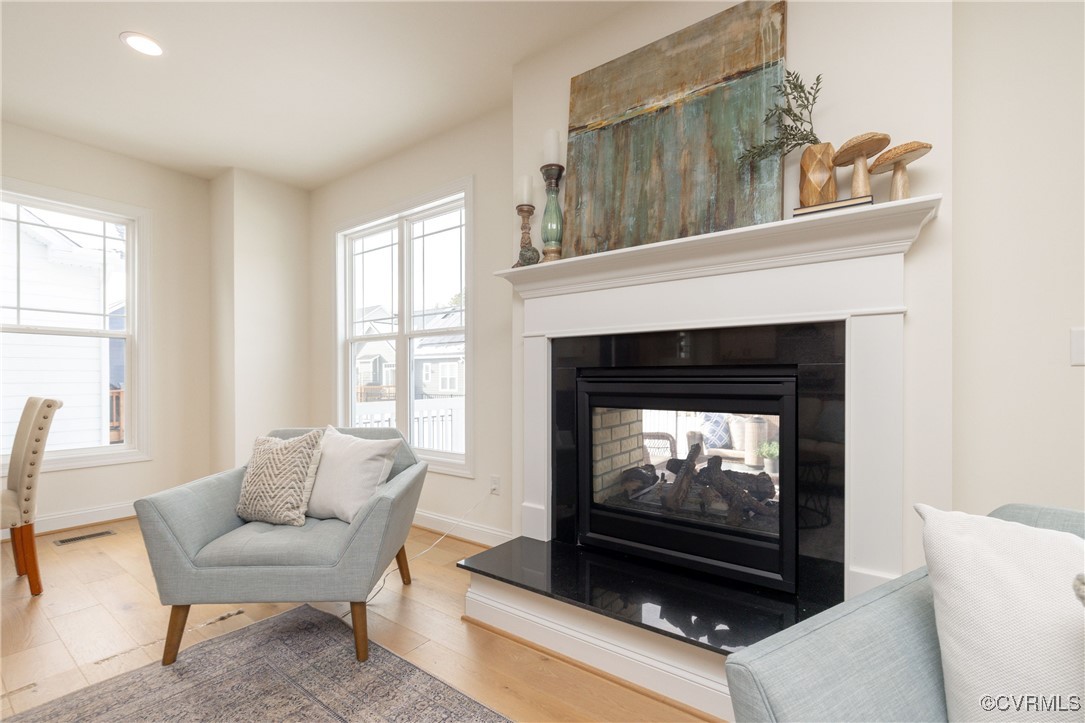 113 Evington Lane Ashland, VA 23005 - Photo 8 of 45 a living room with furniture a flat screen tv and a fireplace