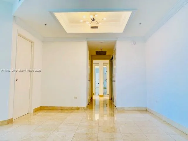 a view of an empty room with a bathroom