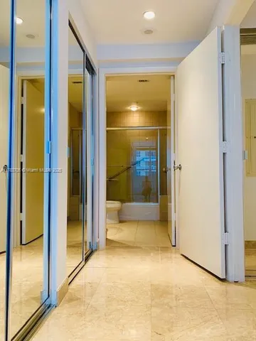 a view of a bathroom with a glass shower door